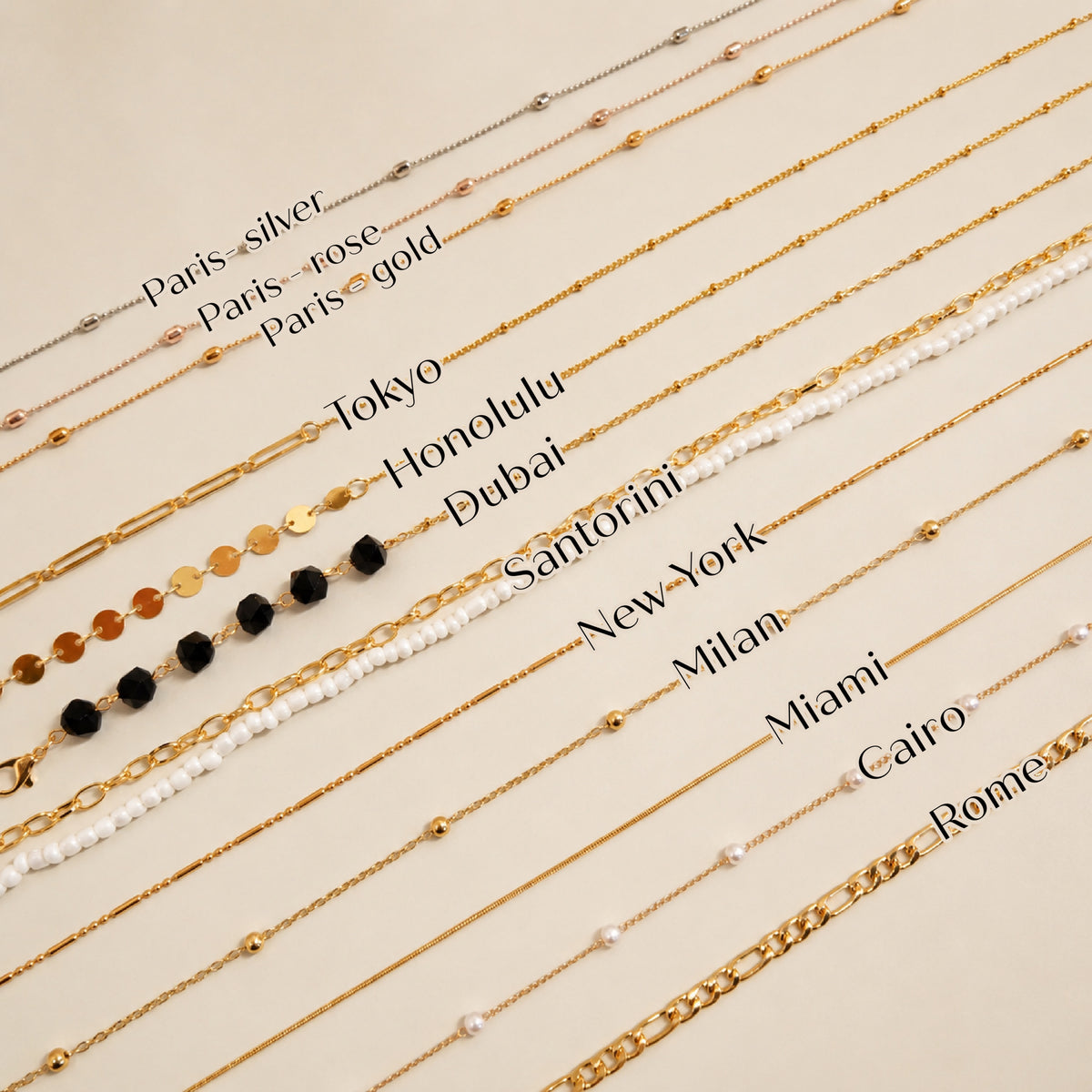 Gold necklaces with different names on a beige background