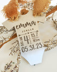 Personalized baby stats ornament with engraved name and birth details on wood