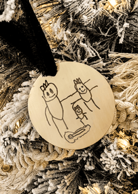 Custom child drawing ornament engraved with stick figure family on gold round base with velvet ribbon