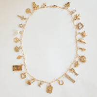 Custom necklace made with 18k gold plated PVD add-on charms in a full charm stack layout