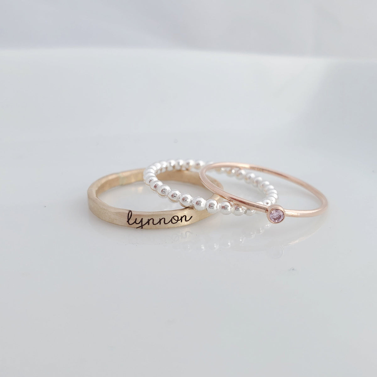 yellow gold personalized ring engraved in our lower cursive font, sterling silver beaded ring, rose gold birthstone ring