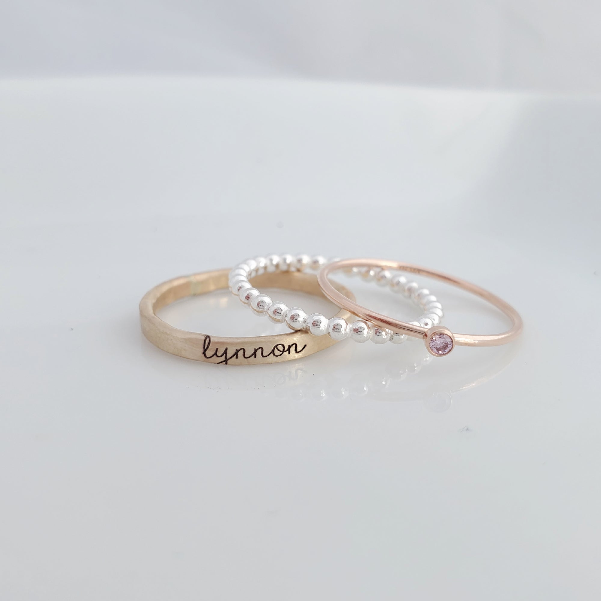 yellow gold personalized ring engraved in our lower cursive font, sterling silver beaded ring, rose gold birthstone ring