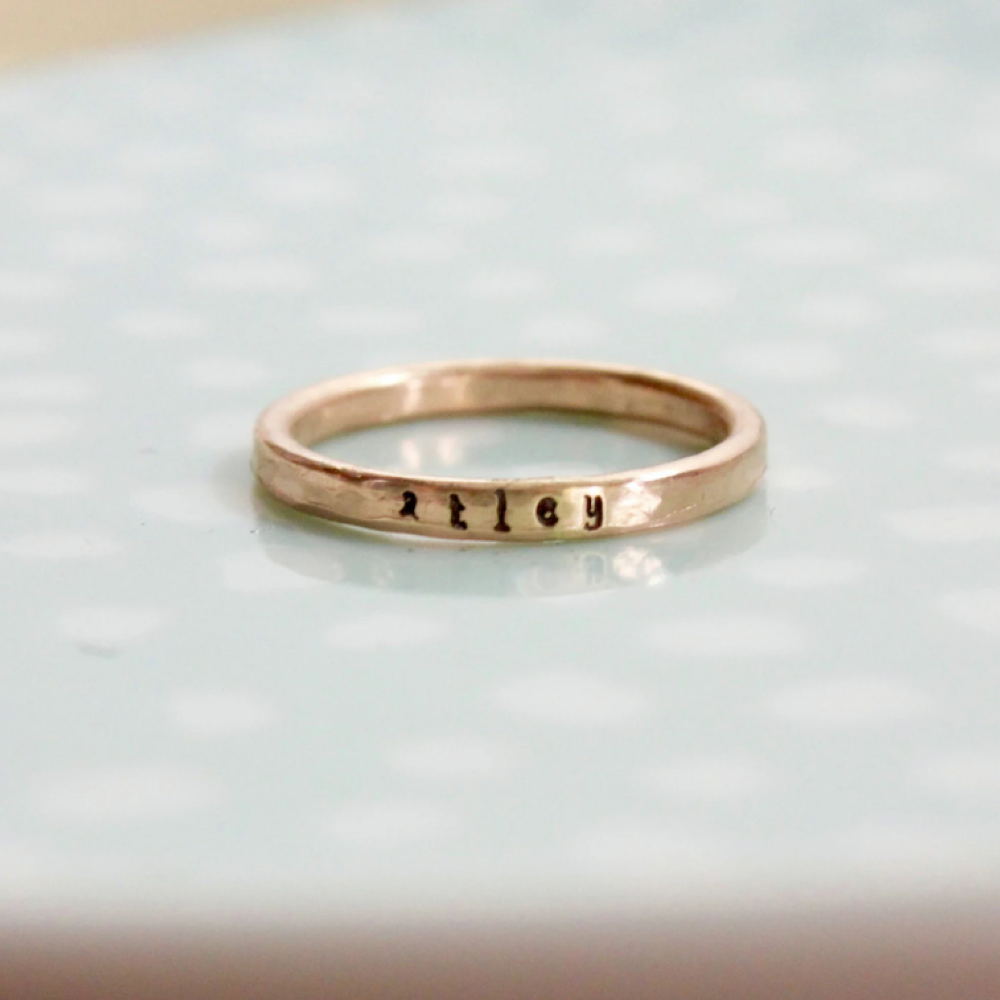 Single 2mm 14k rose gold-filled ring handstamped with a name