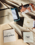 Going Golden jewelry gift packaging including boxes and pouches for necklace presentation