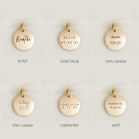 Gold pendants with different text styles on a light gray background