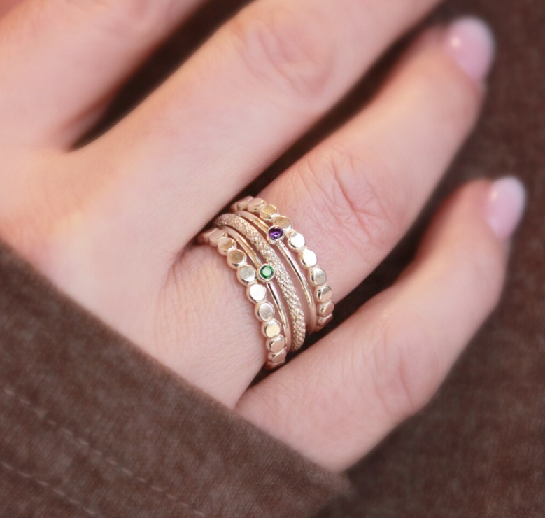 a set of yellow gold filled rings on woman&#39;s ring
