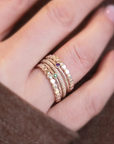 a set of yellow gold filled rings on woman's ring