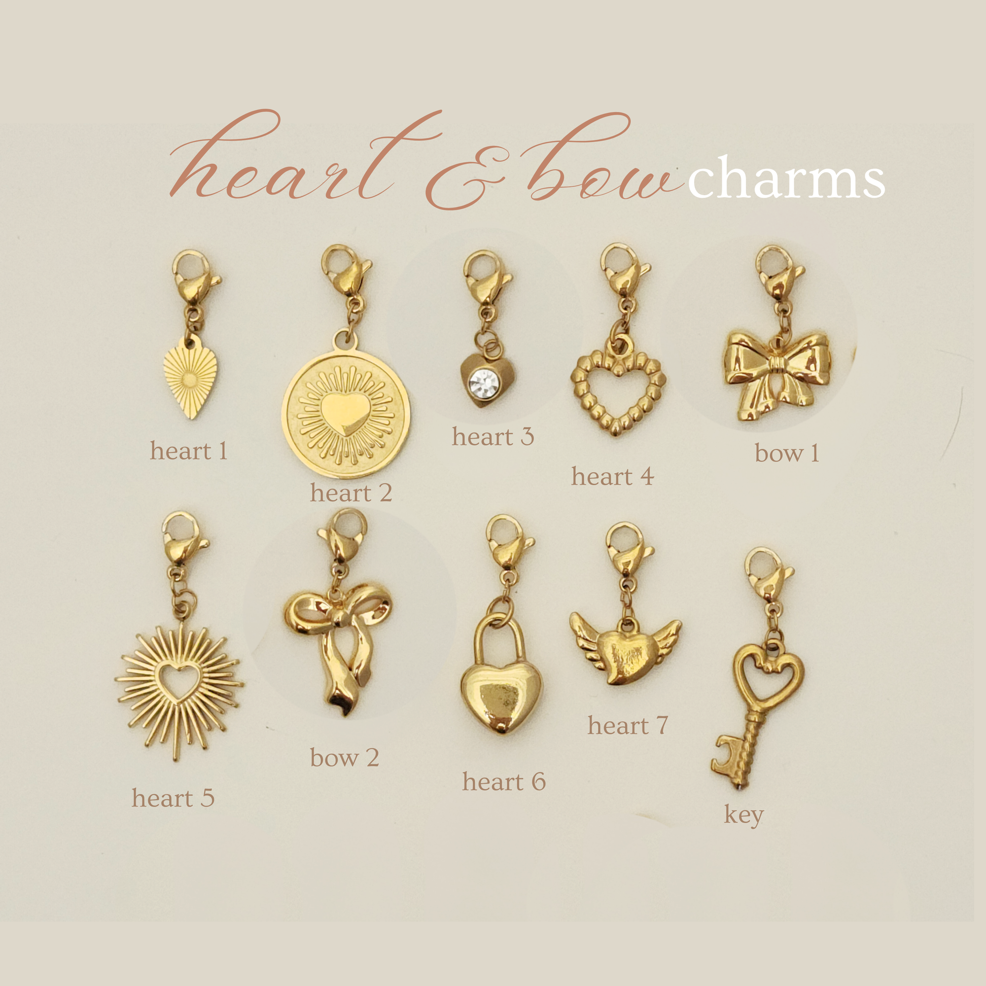 Gold heart and bow charms on a beige background with labels.