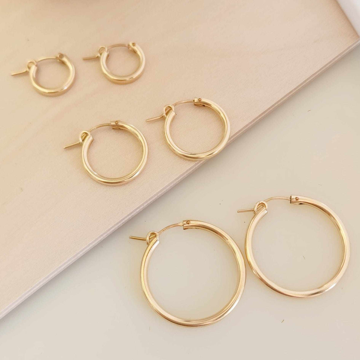 Classic gold and silver hoop earrings in three sizes