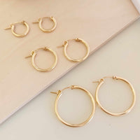 Classic gold and silver hoop earrings in three sizes