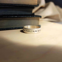 Men's sterling silver engraved name ring with oxidized finish