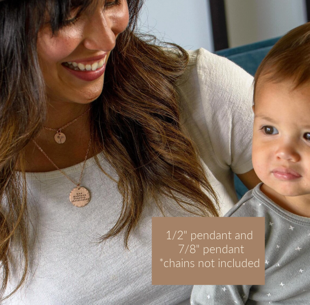 Woman holding a child with pendants displayed on a text box