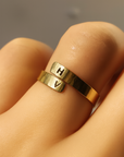 Personalized gold initial cuff ring hand-stamped with letters H and V