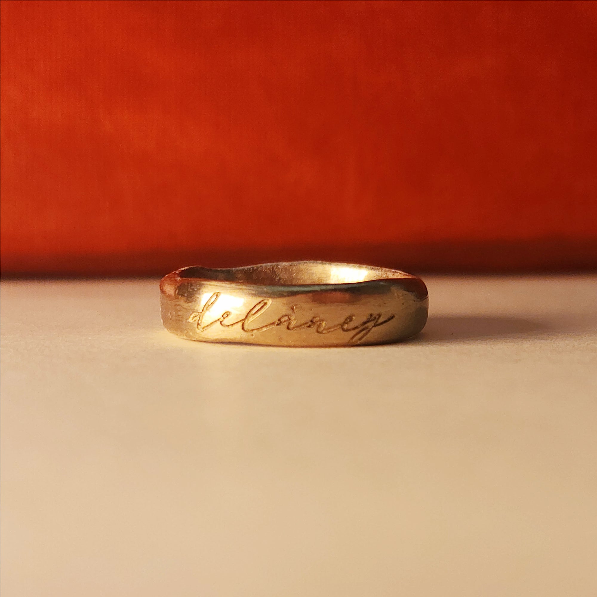 Gold ring with &quot;Delaney&quot; undarkened