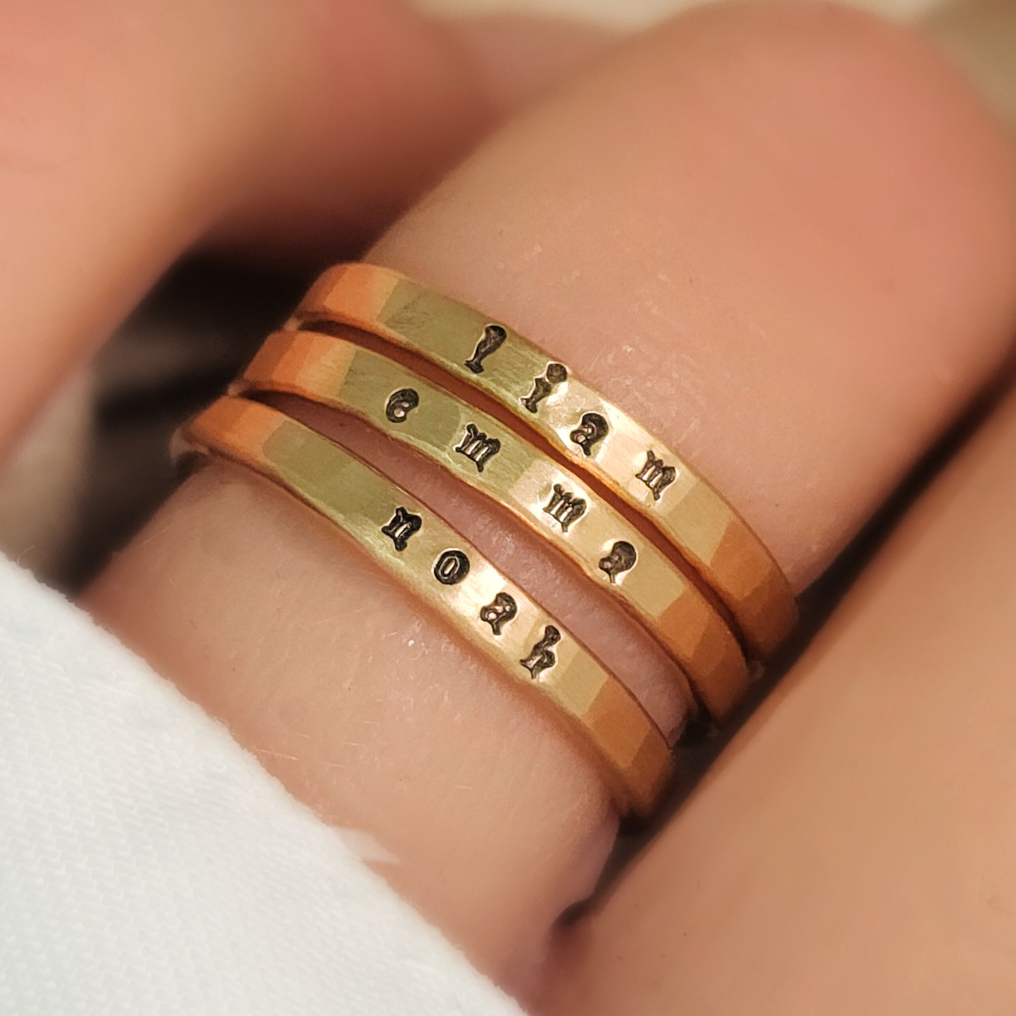 Everyday wear jewelry, stacking rings stamped with tiny font