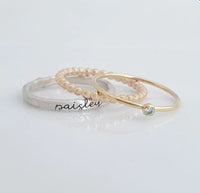 Three rings on a light gray background