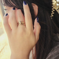 hannah set on finger with hand sweeping behind hair