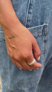 handcrafted-silver-ring-on-woman-hand-denim-outfit