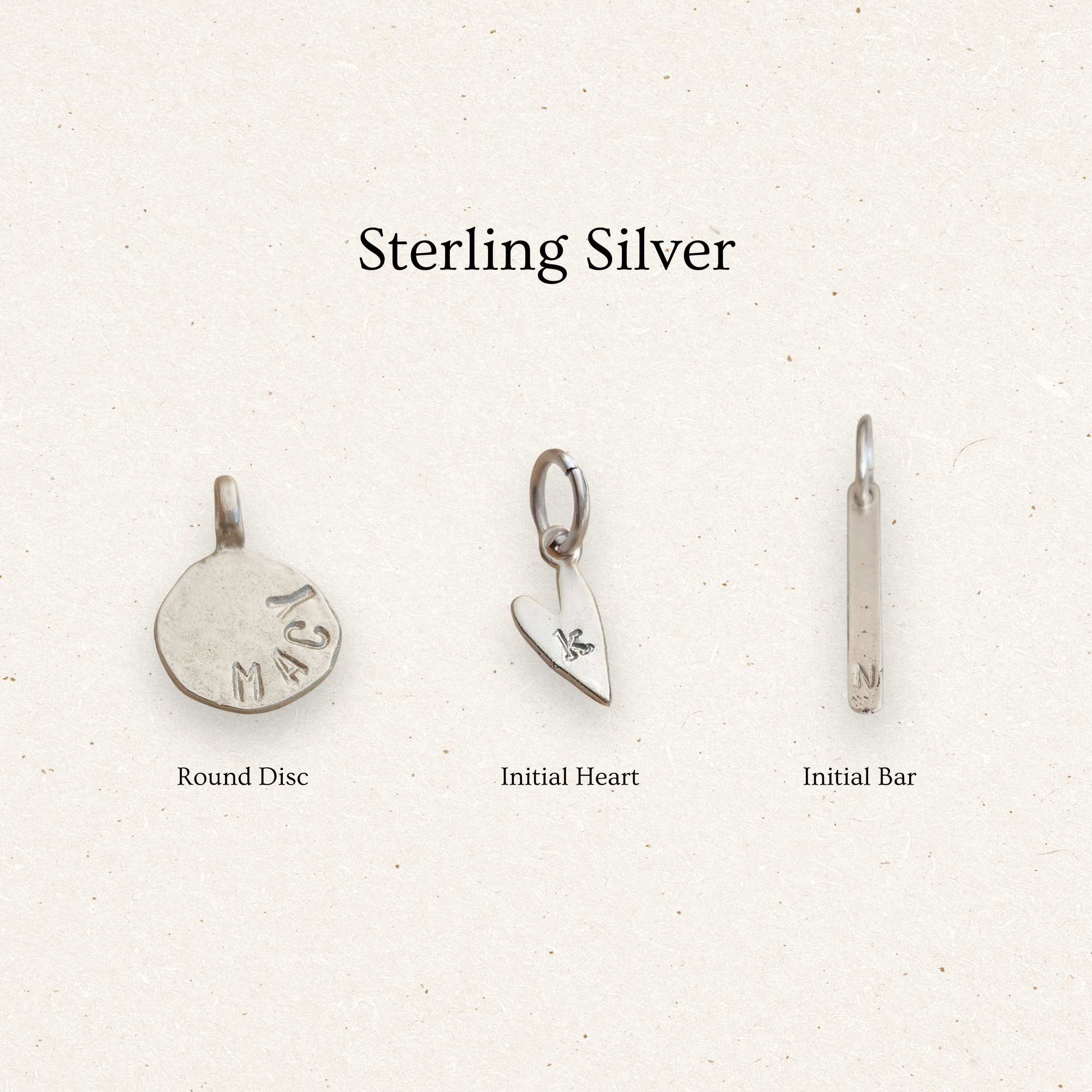 Three sterling silver charms on a light background with 'Sterling Silver' text.