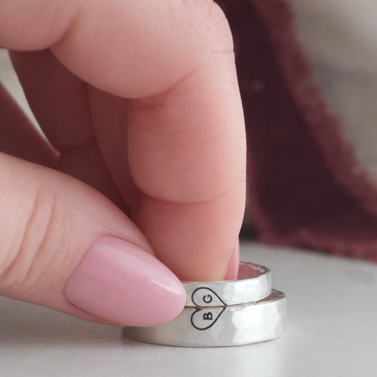 Sweetheart ring with engraved initials.