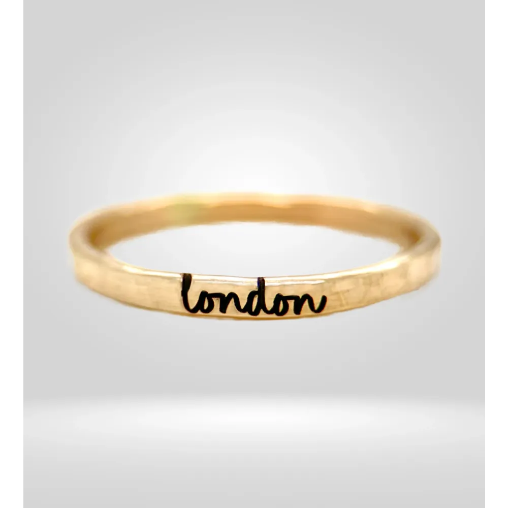 Yellow gold custom ring with personalized handwriting font "Ainsley Rae" design, size 7.5.