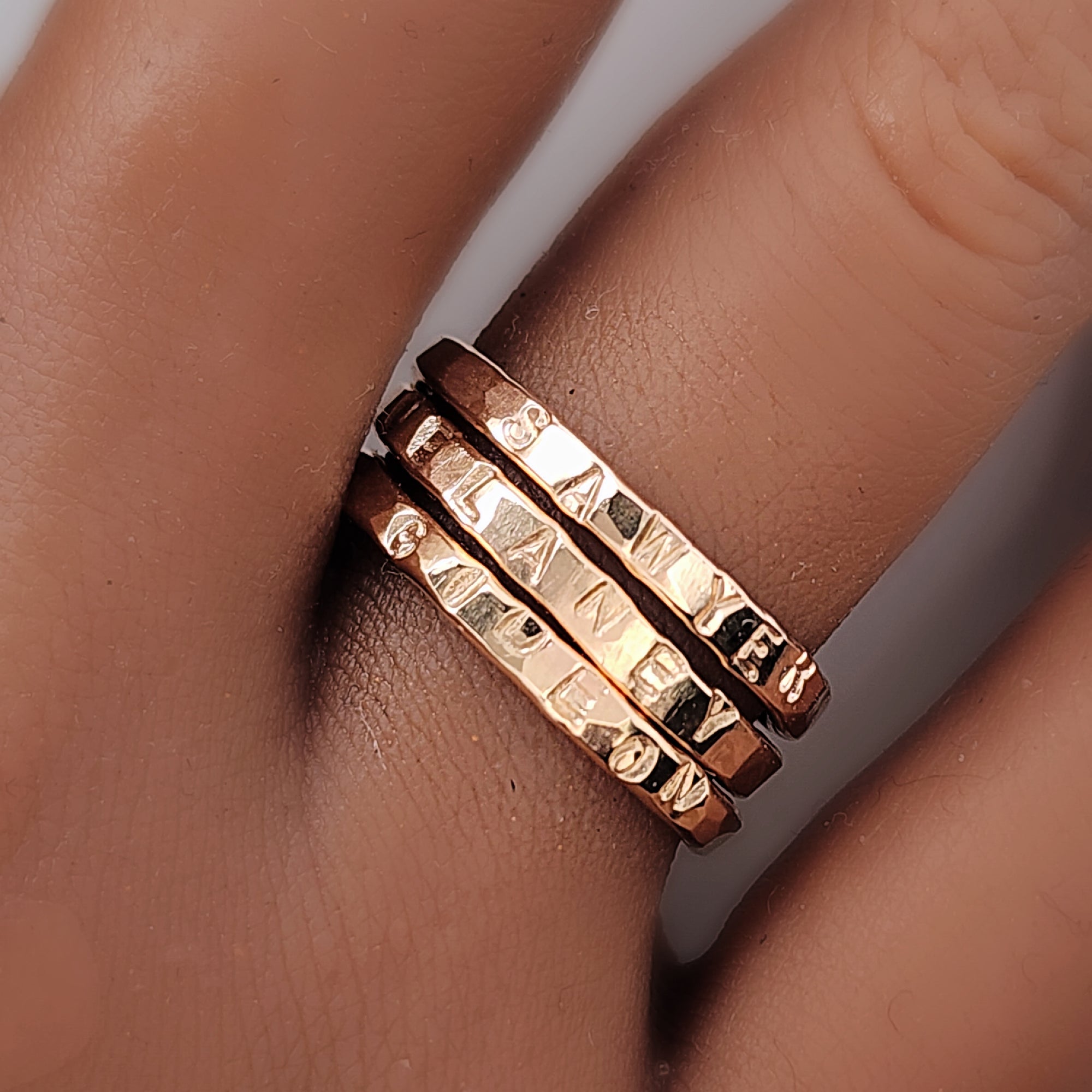 three gold name rings handstamped on hand