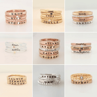 Custom personalized stacking ring sets with names and dates in sterling silver, fine silver, and 14K gold filled options