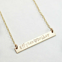 Gold bar necklace with "Ellysen ♥ Dekker" engraving